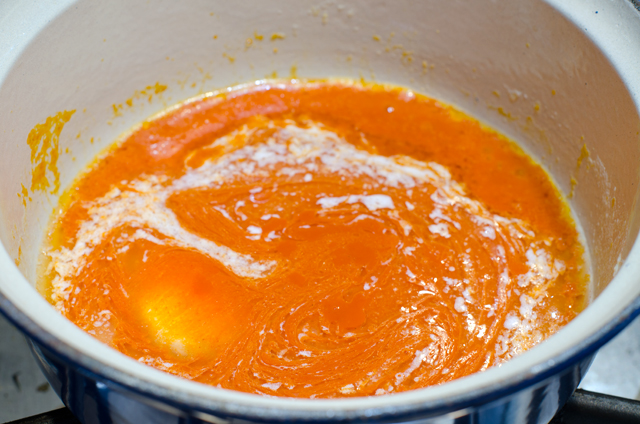 While the cauliflower is baking, stir together melted butter and hot sauce.