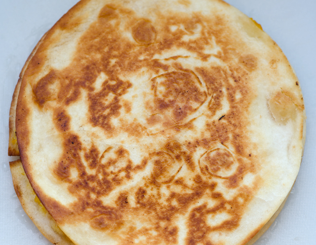 Cook individual tortillas in a non stick pan on both sides until they are golden brown.